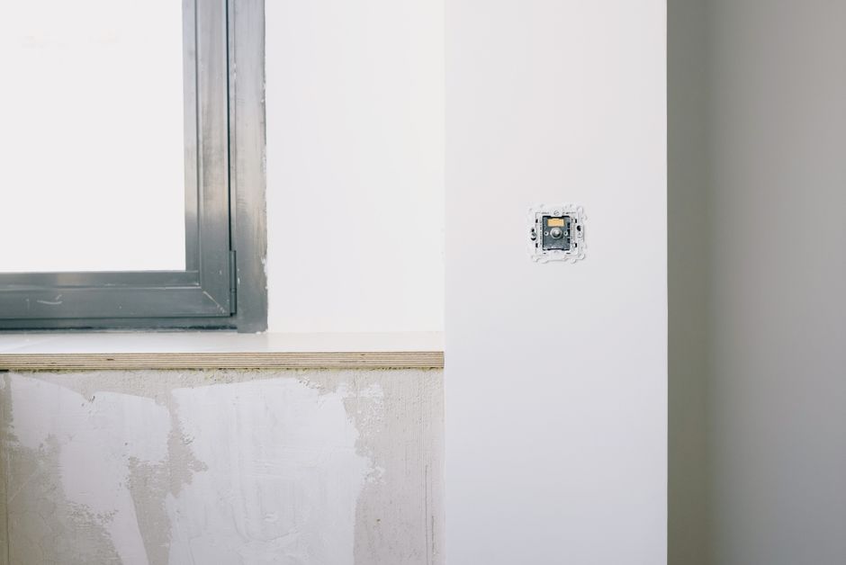 White window frame set in a light interior wall
